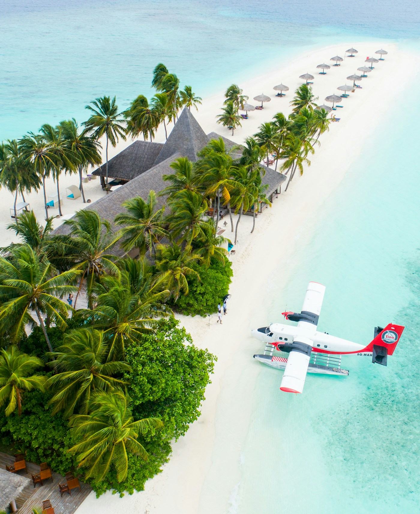 Aerial view of a beach resort and turquoise shallows
