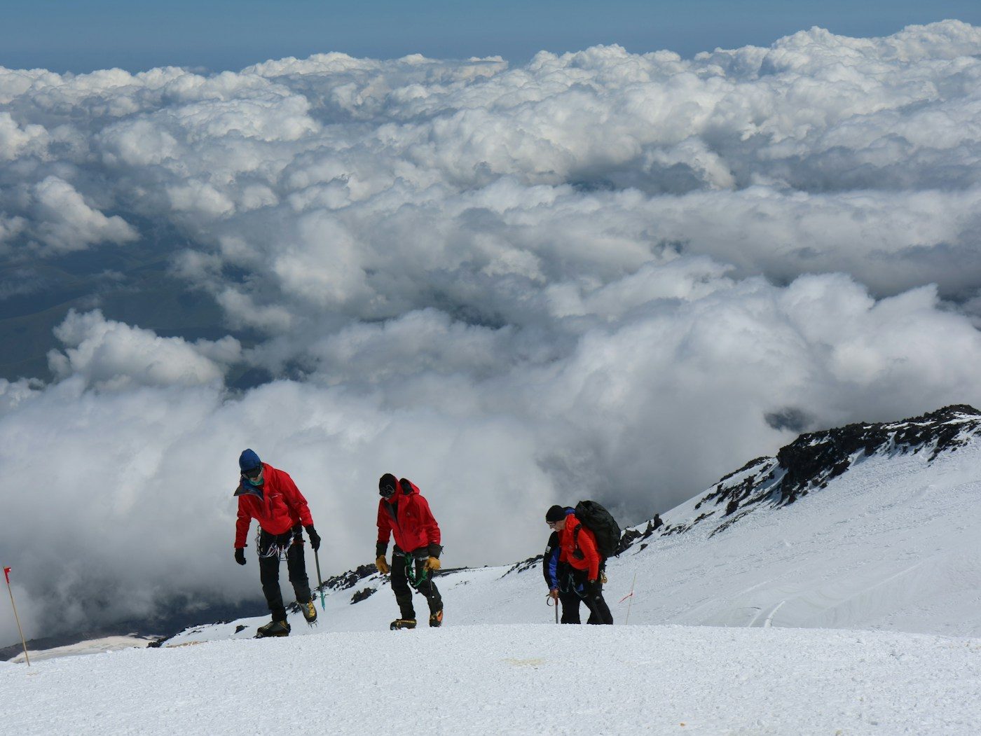 KissRock guides crossing a glacier field near the summit