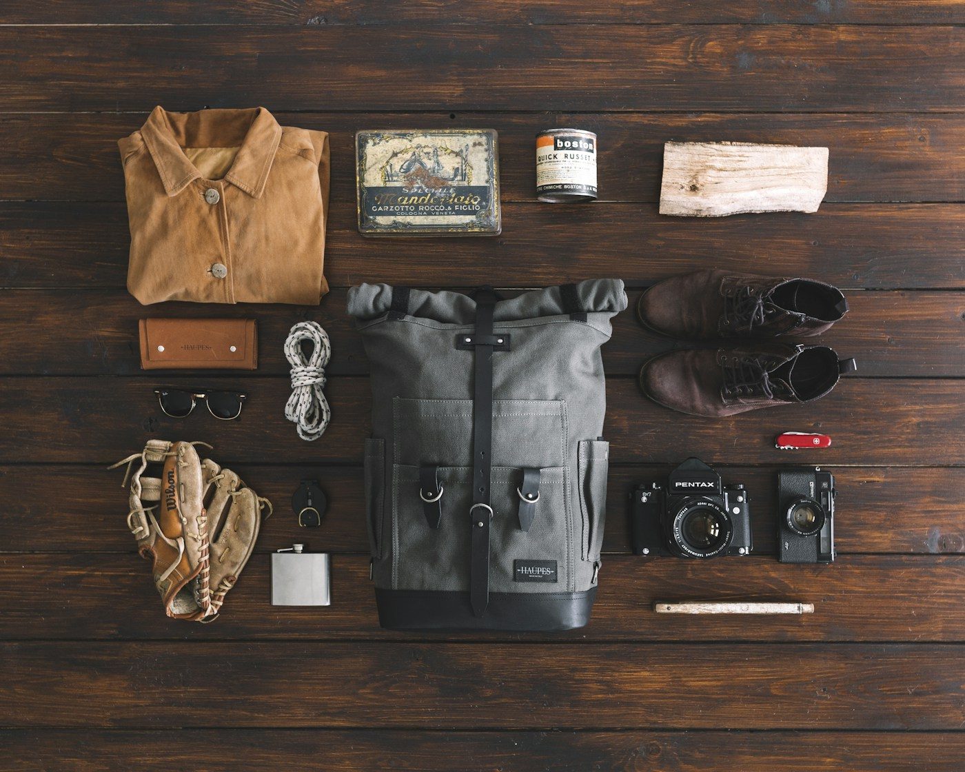 Trekking clothing and equipment laid out before a climb