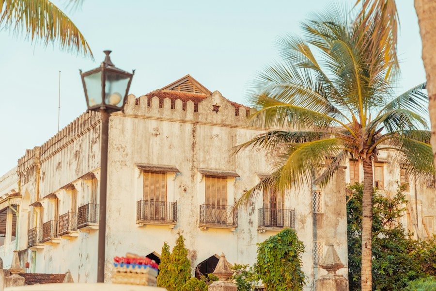 A colonial-era building framed by palm trees